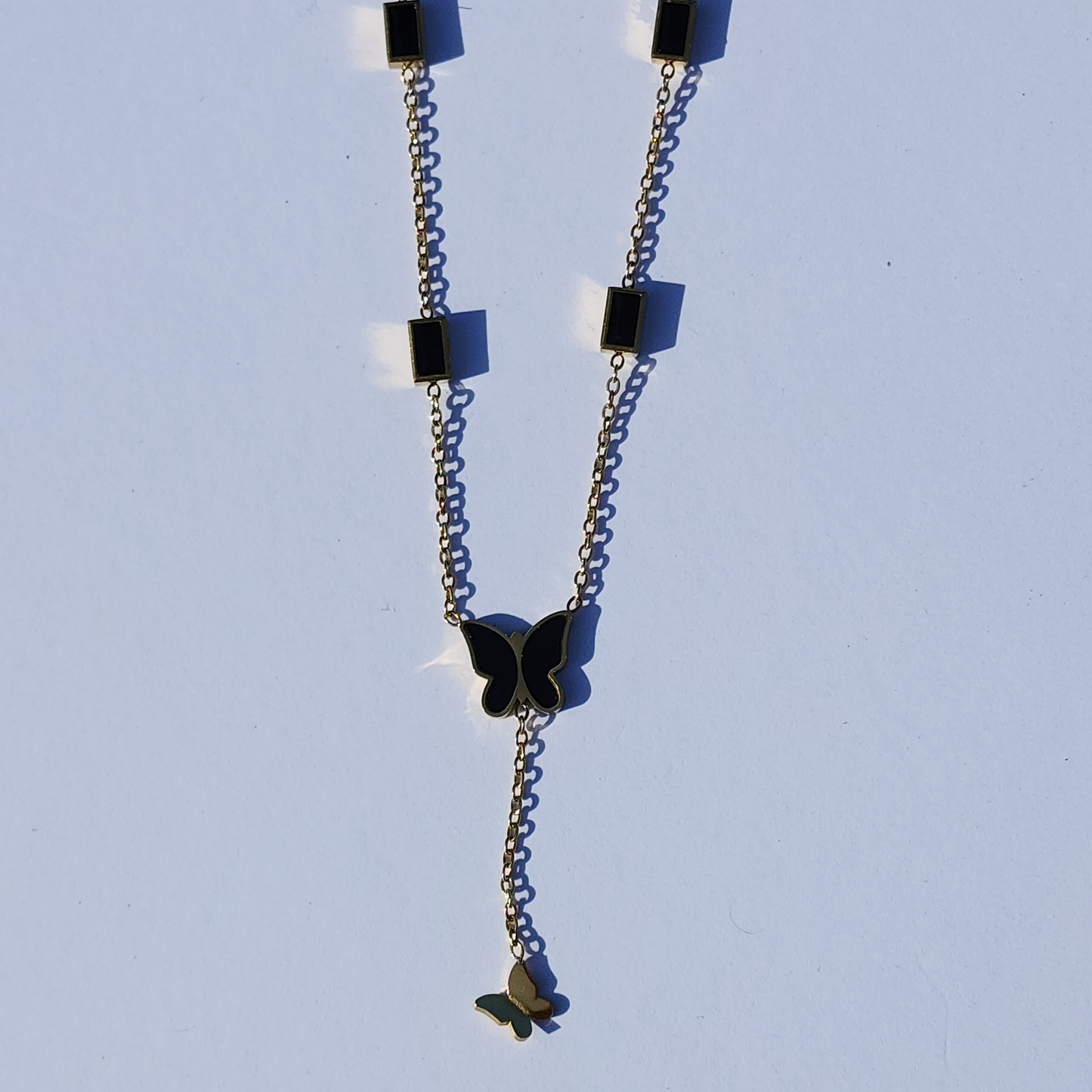 Midnight Muse Necklace – 18K Gold-Plated Lariat with Black Butterfly Charm