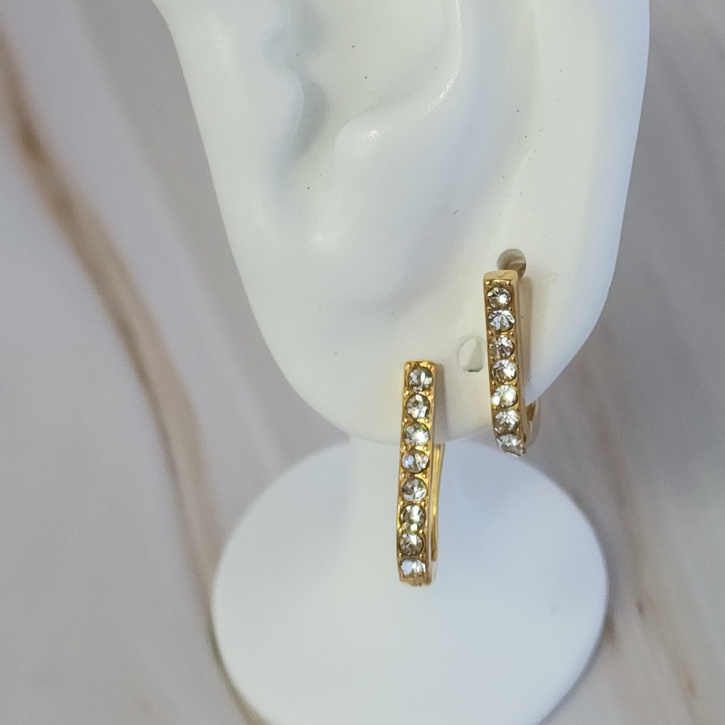 Gleam Curve Hoops – Gold-Toned Mini Hoops with Sparkling Zircon Accents