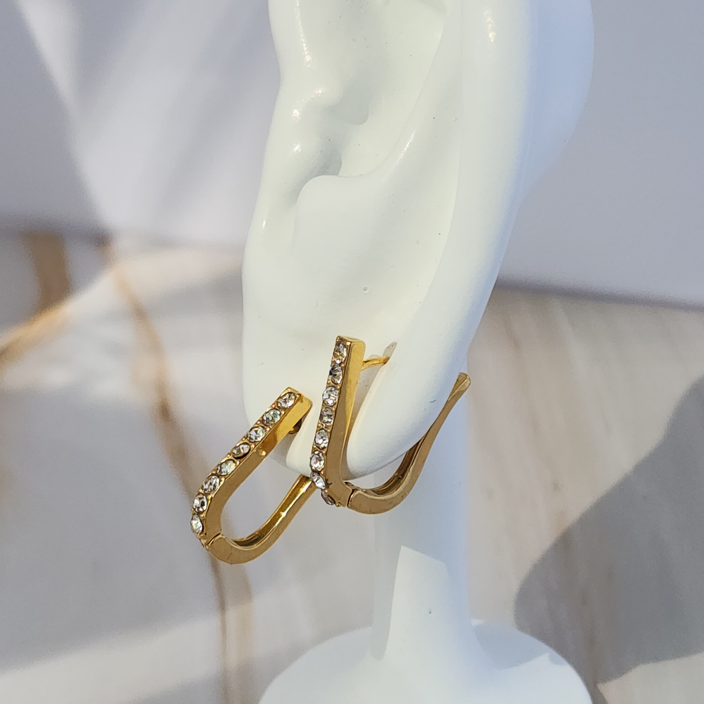 Gleam Curve Hoops – Gold-Toned Mini Hoops with Sparkling Zircon Accents