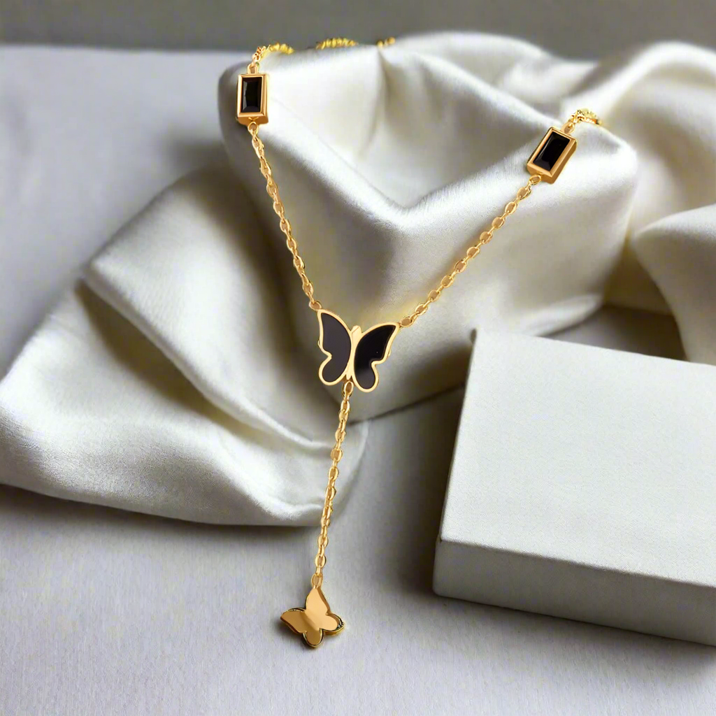 Midnight Muse Necklace – 18K Gold-Plated Lariat with Black Butterfly Charm